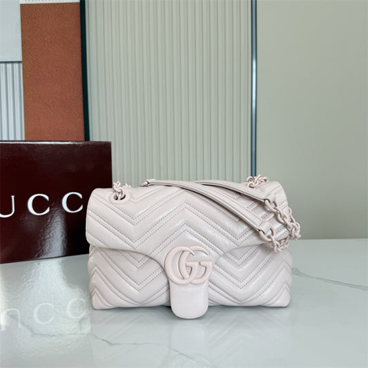 Gucci GG Marmont Small Matelassé Shoulder Bag in a light pink hue.