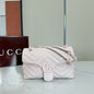 Gucci GG Marmont Small Matelassé Shoulder Bag in a light pink hue.