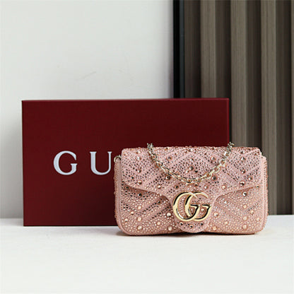 Gucci GG Marmont Crystal Small Shoulder Bag in pink matelassé leather.
